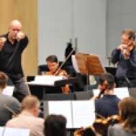 The orchestra of the State Theatre Stuttgart rehearsing under James Tuggle.
